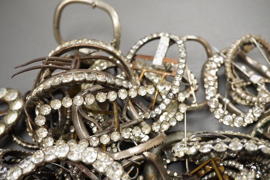 A large collection of buckles, 18th-19th century, of oval and rectangular outline, set with pastes mostly mounted in steel, a minority in silver, some with later brooch fittings